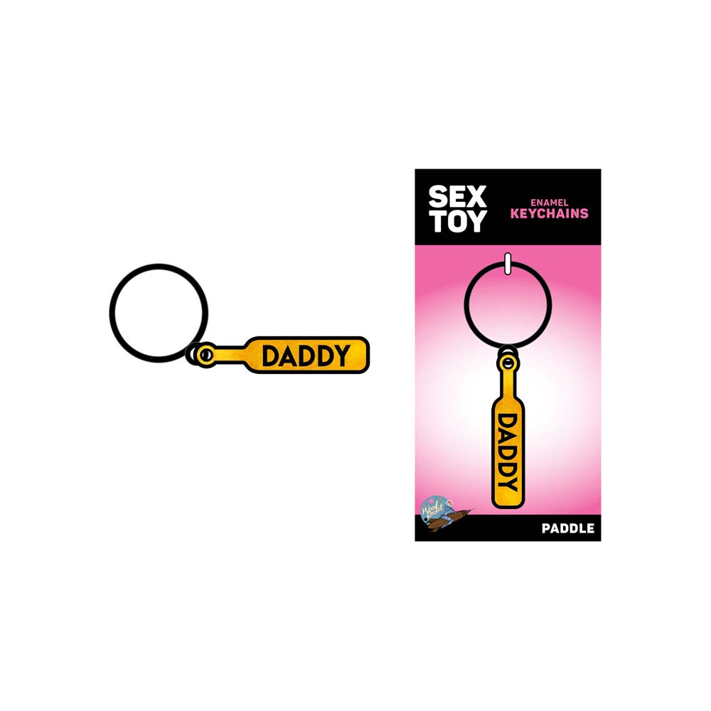 Daddy paddle enamel keychain with gold lettering on a white background.