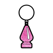 Pink glitter butt plug keychain with a metal ring.