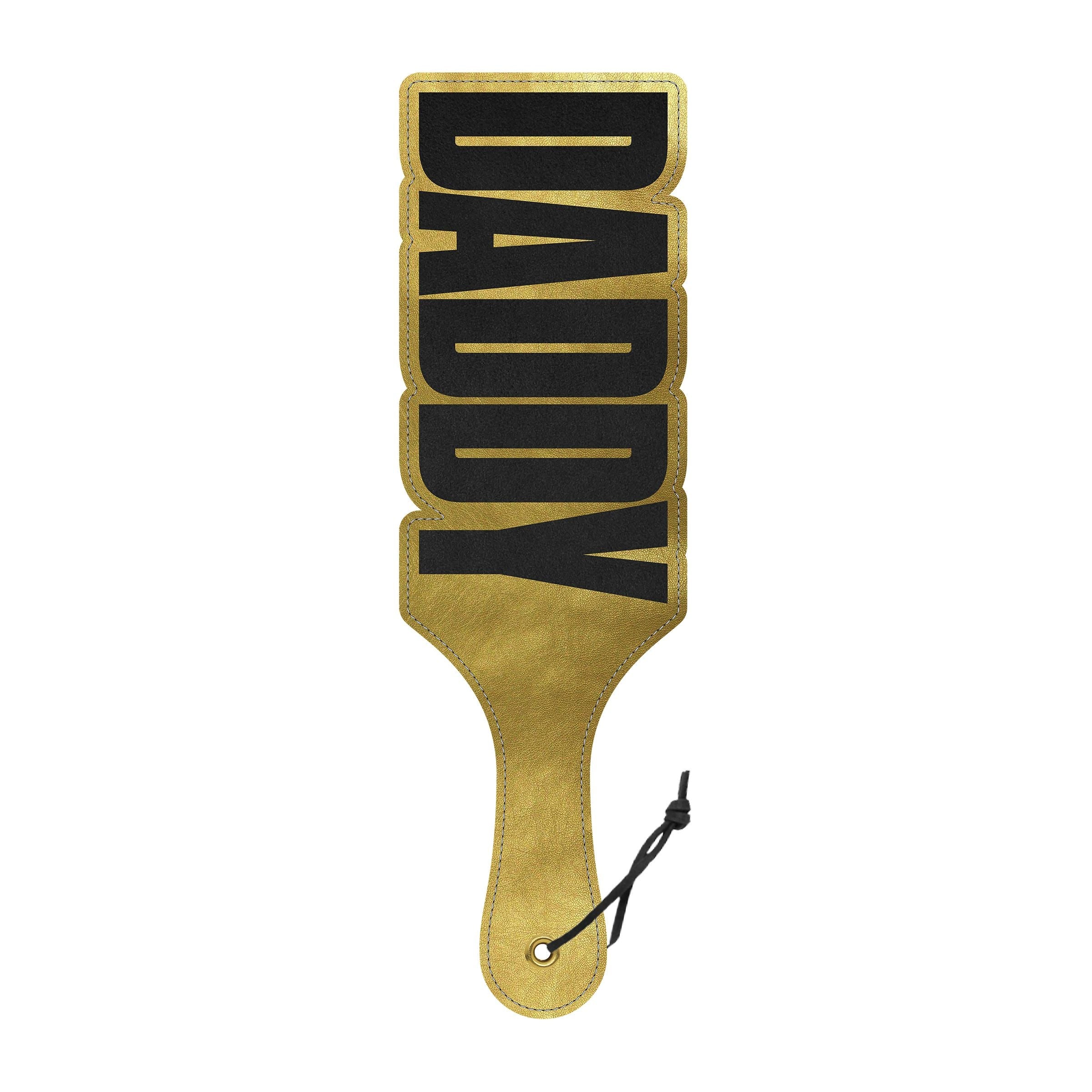 Gold spanking paddle with "DADDY" cut-out design.