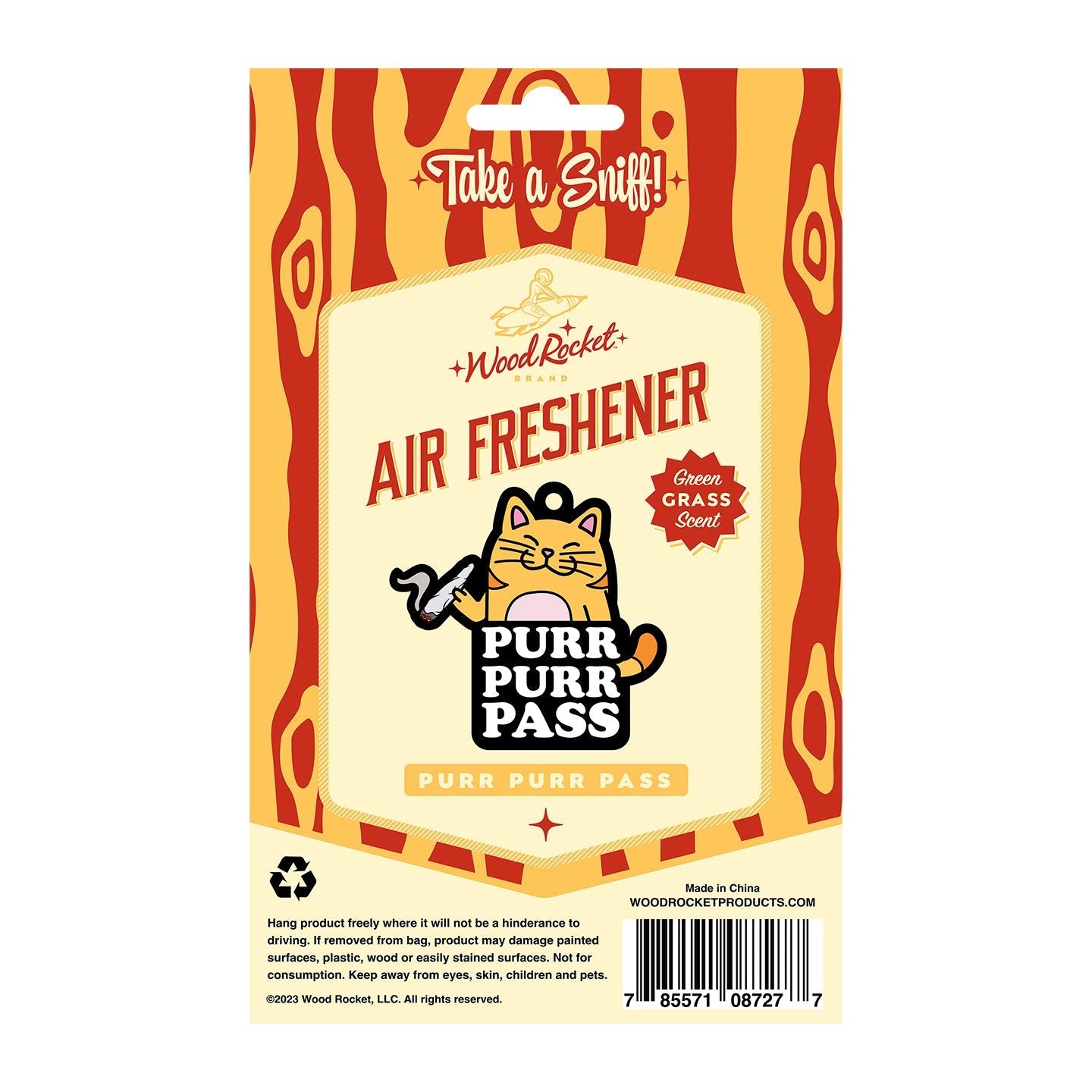 Wood Rocket Purr Purr Pass air freshener with a cat graphic and green grass scent.