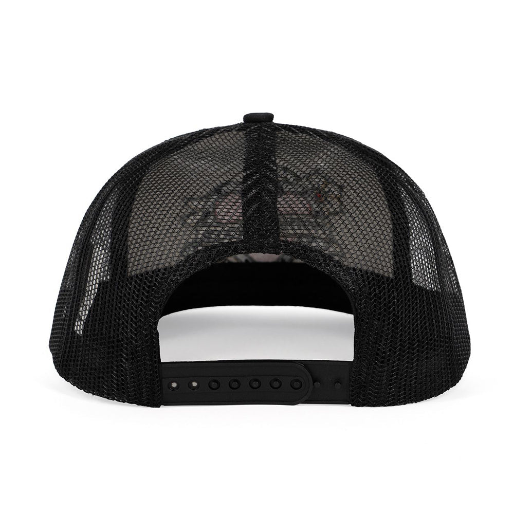 Black trucker hat with embroidered tattoo heart graphic and snapback closure.
