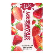 Strawberry flavored personal lubricant with whole and sliced strawberries.