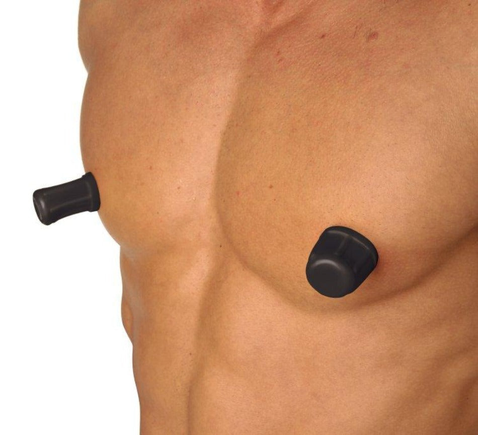 Black vacuum suction nipple suckers on a person's chest.