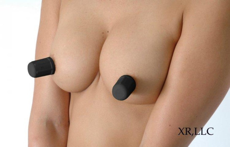 Black Viper Nipple Suckers on a woman's breasts, creating vacuum suction.