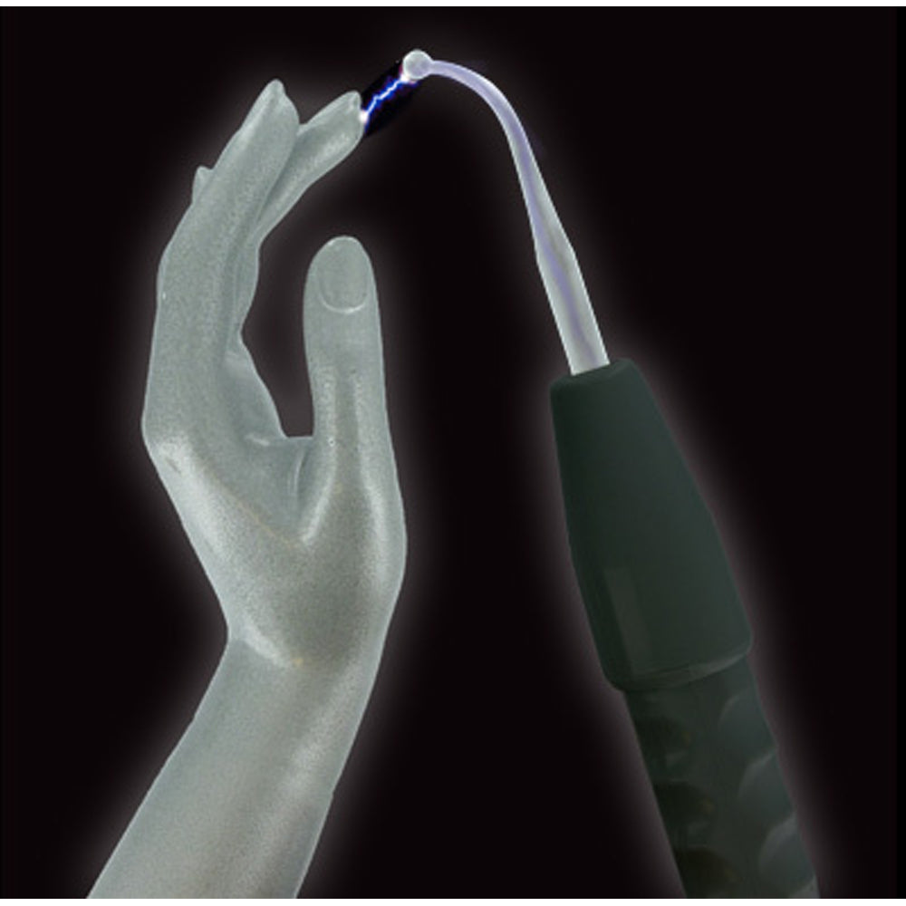 Violet wand kit with a glass electrode creating a spark near a translucent hand.