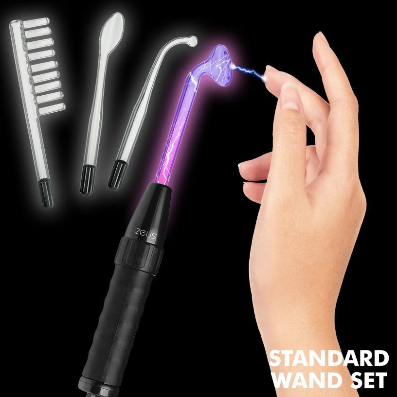 A hand holds a violet wand with electrical arcs, with three glass electrodes in the background.