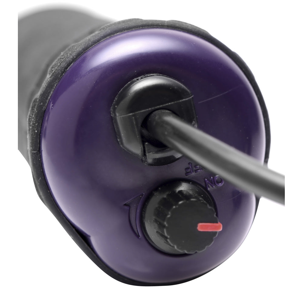Close-up of a purple violet wand handle with an on/off dial.