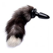 A black and white faux fox tail anal plug with a tapered base.
