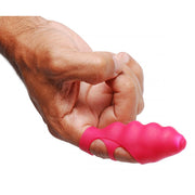 Pink silicone finger vibrator with textured surface.