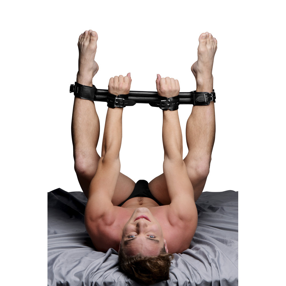 Rigid spreader bar with padded PU leather cuffs for couples.