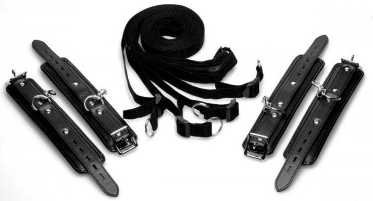 Black padded PU leather cuffs and straps for bed restraint.
