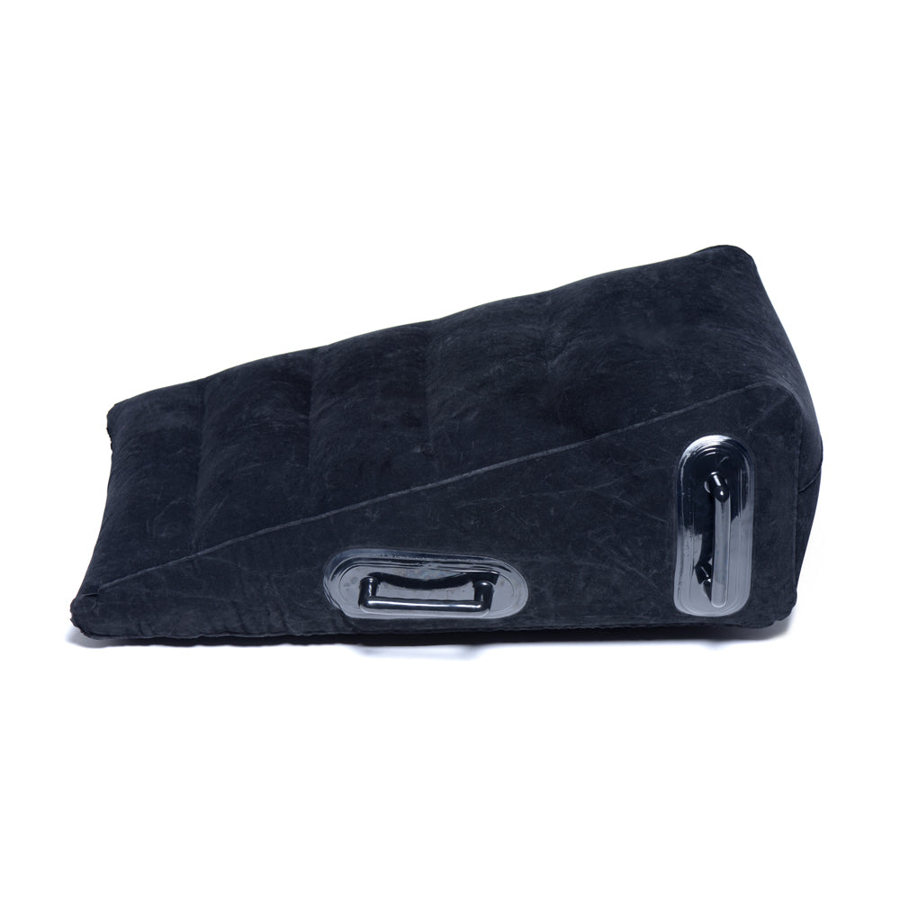 Black inflatable wedge pillow with handles for sex positions.