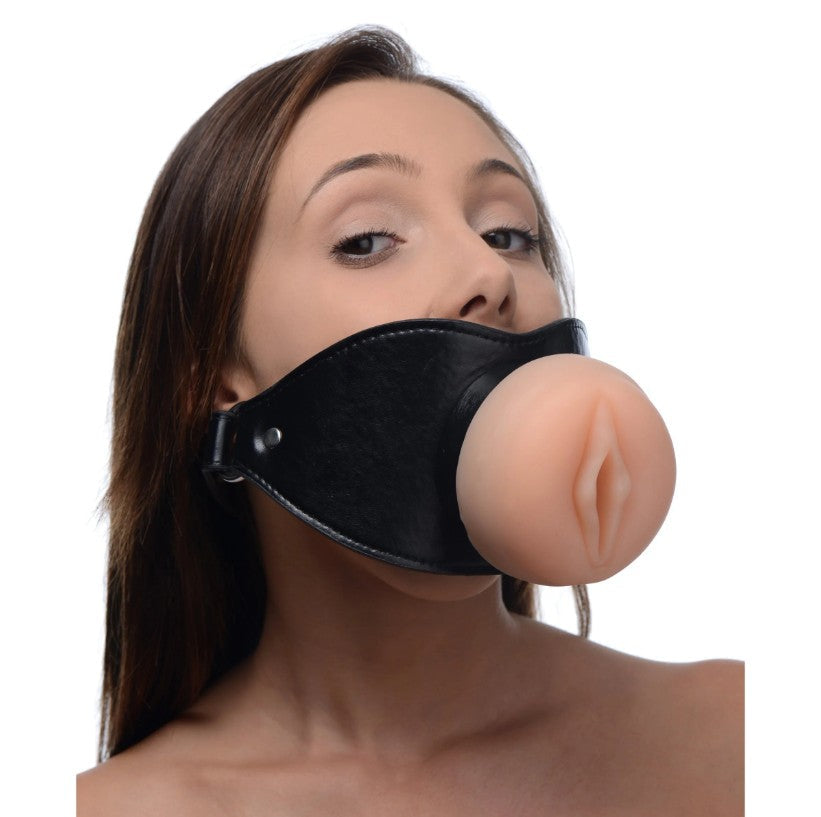 Black leather open mouth gag with a realistic TPE vulva opening.