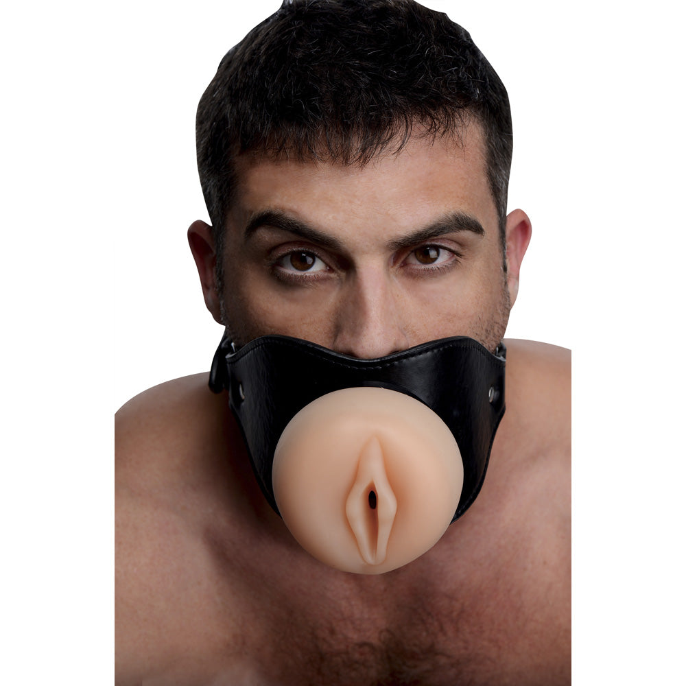 Black leather open mouth gag with realistic TPE vulva opening.