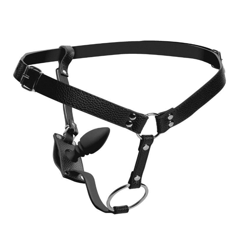 Black leather harness with adjustable straps and a silicone anal plug.