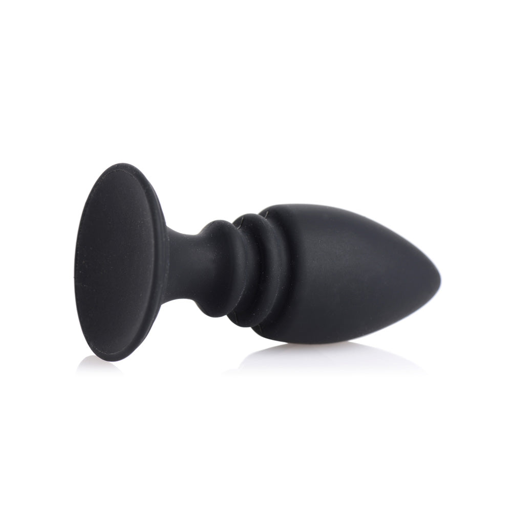Black silicone anal plug with a flared base and ribbed shaft.
