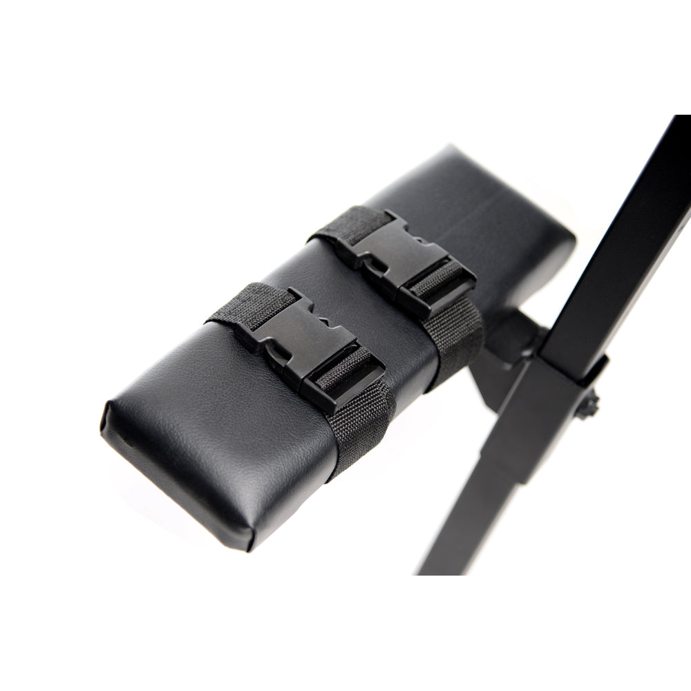 Black padded bench attachment with two black buckle straps.
