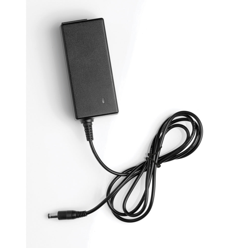 Black power adapter with a coiled cord and a barrel connector.