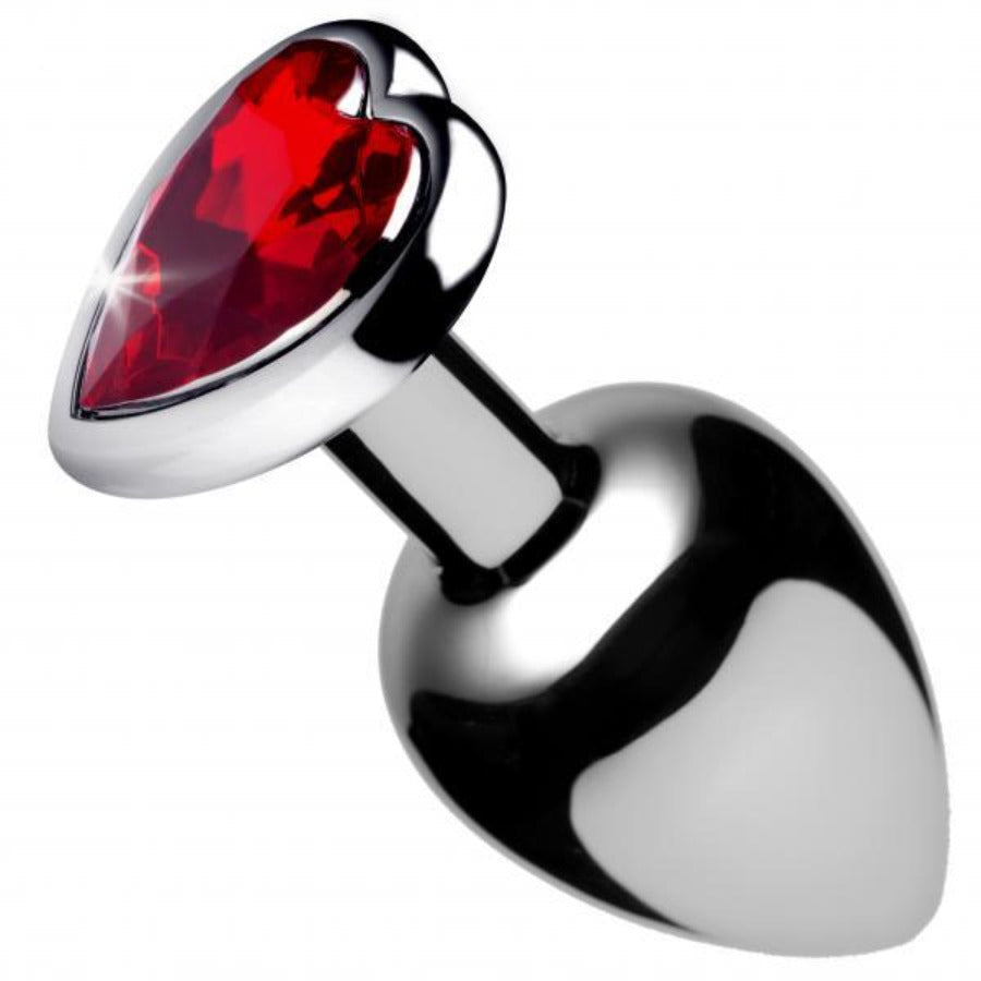 Small silver anal plug with a red heart-shaped gem.