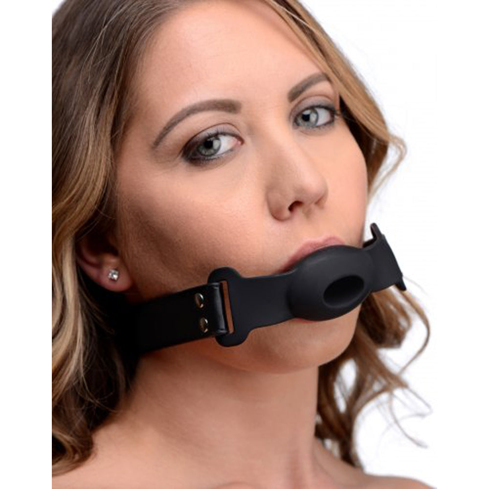 Black silicone gag with a hollow opening and adjustable strap.