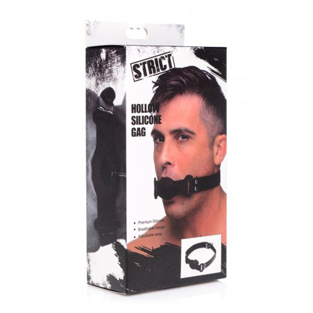 Hollow silicone gag with adjustable strap on a man's face.