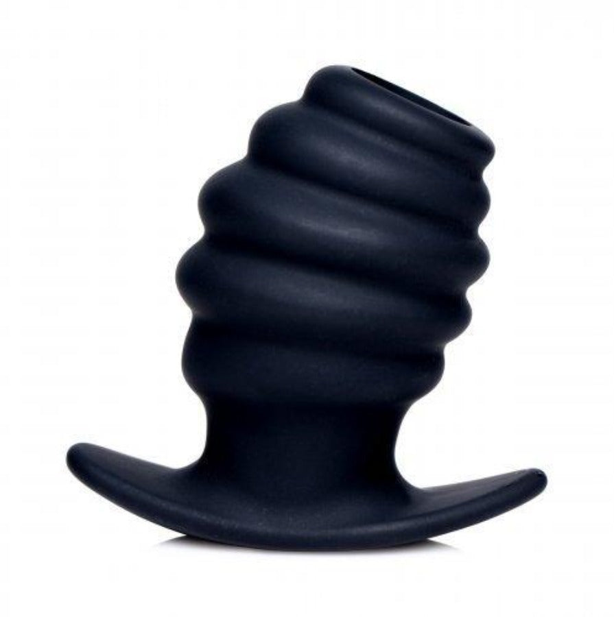 Black ribbed hollow anal tunnel plug made of silicone.