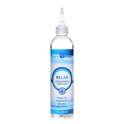 Clear bottle of Relax Desensitizing Lubricant with a nozzle tip.