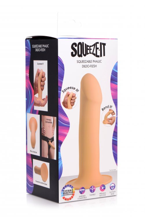 Squeezable light flesh silicone phallic dildo with suction base in its box.