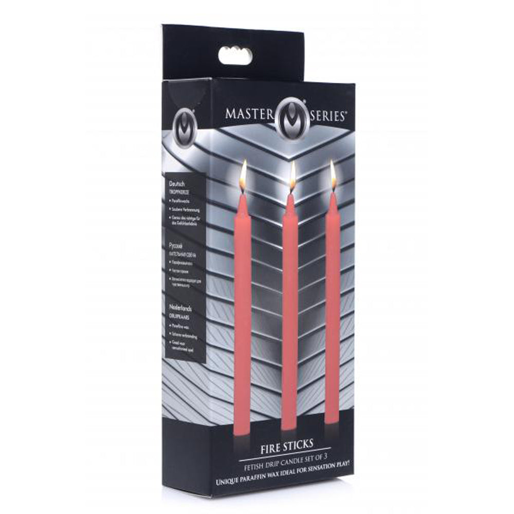 Three red fetish drip candles in a box.