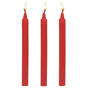 Three red drip candles with lit wicks.