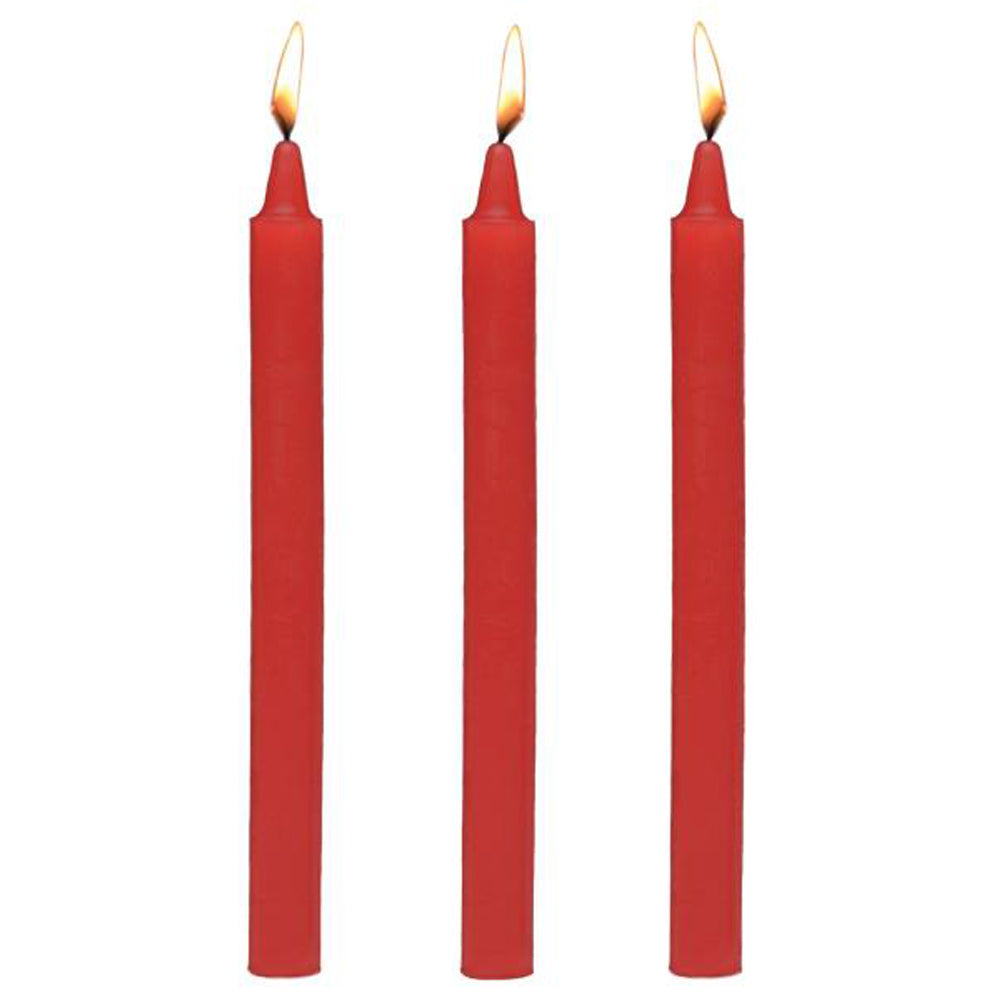 Three red drip candles with lit wicks.