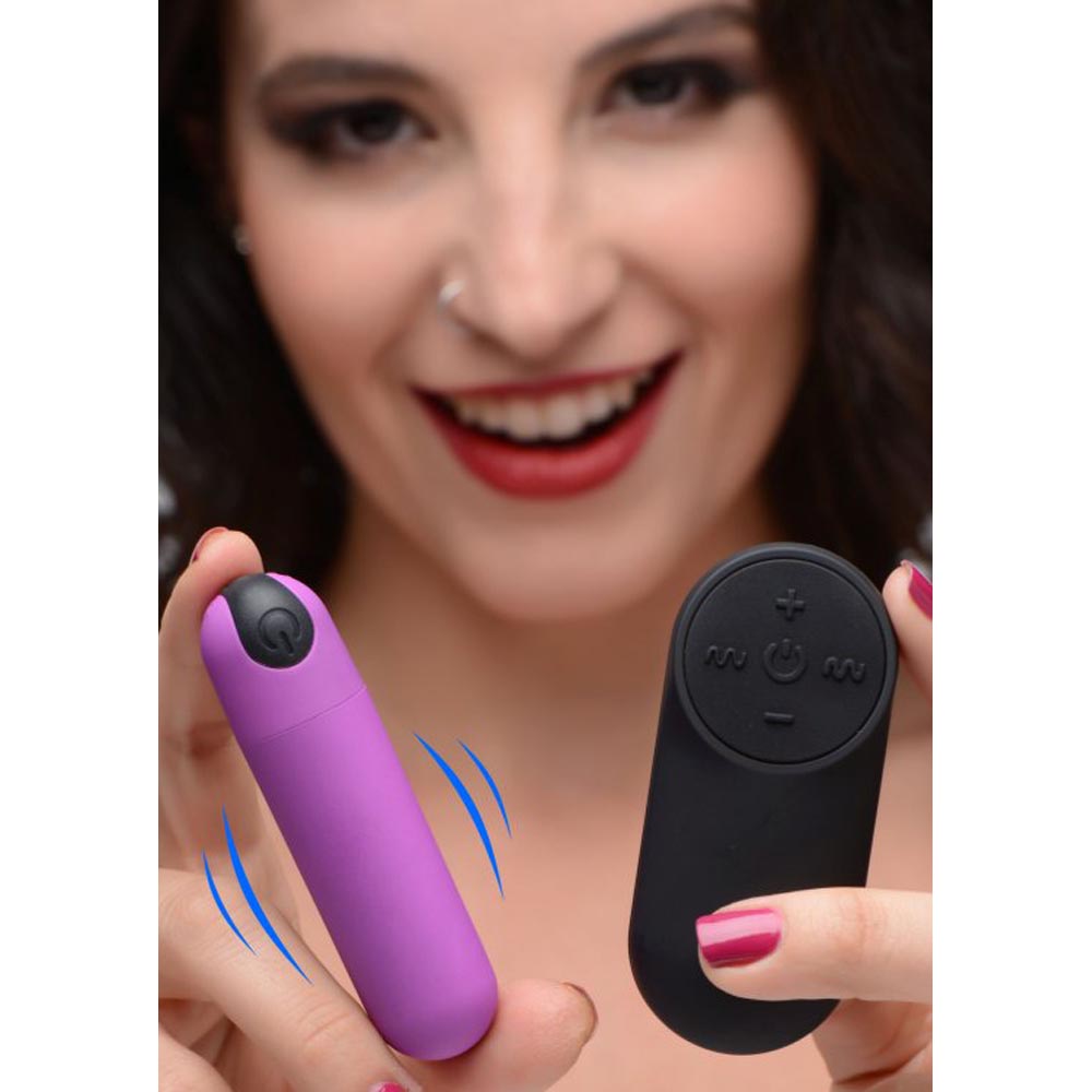 Purple rechargeable vibrating bullet with a black remote control.