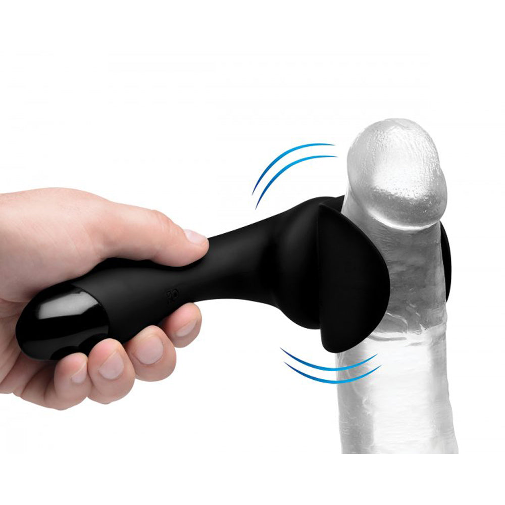 Black silicone penis teaser wand held by a hand, with blue motion lines.