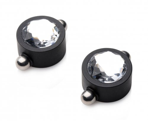 Two black nipple clamps with clear gems and silver balls.