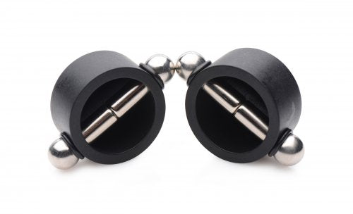 Black nipple clamps with polished steel accents and magnetic gems.
