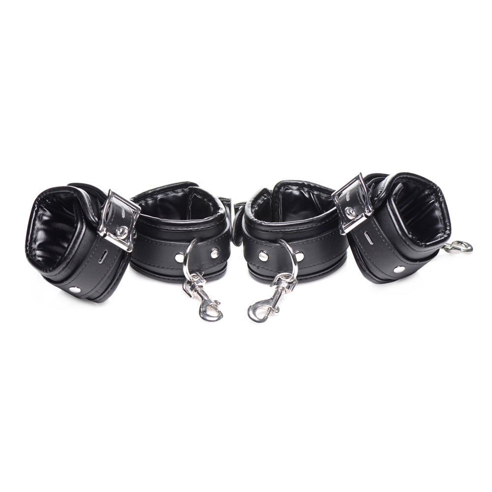 Black leather cuffs with metal clasps and clips.