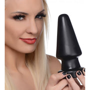 Large black PVC anal plug with a tapered tip.