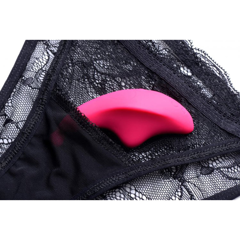 Black lace panties with a pink vibrator inside.