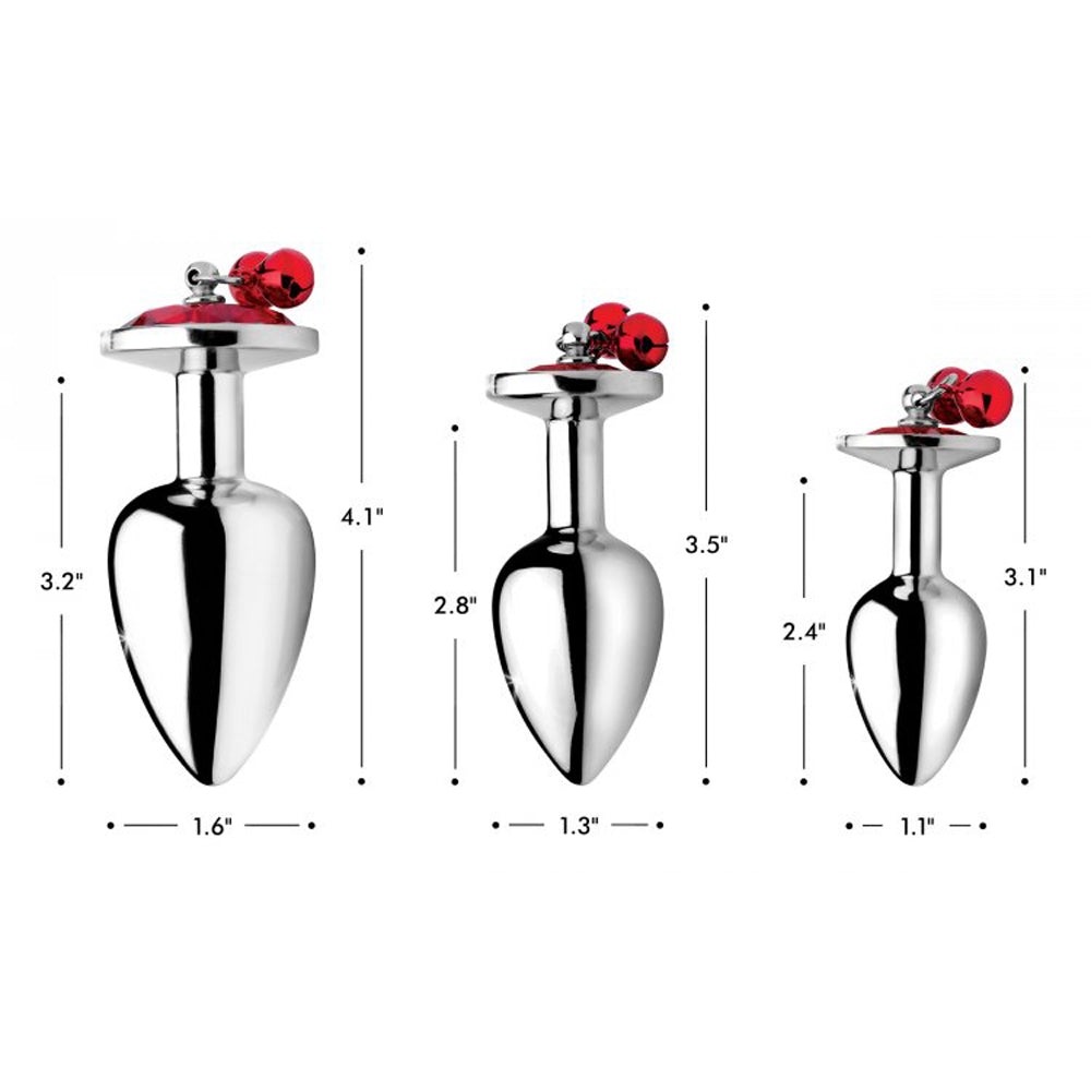 Three aluminum anal plugs with red gems and bells in graduated sizes.