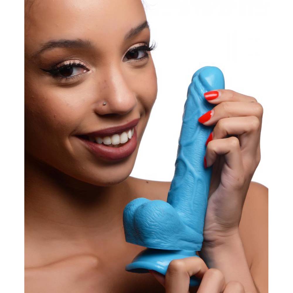 Blue realistic dildo with suction cup and textured shaft.