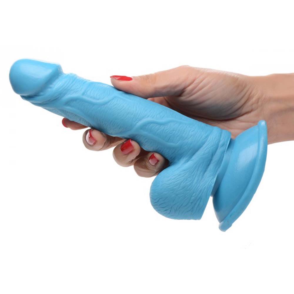 Blue realistic dildo with suction cup base and textured shaft.
