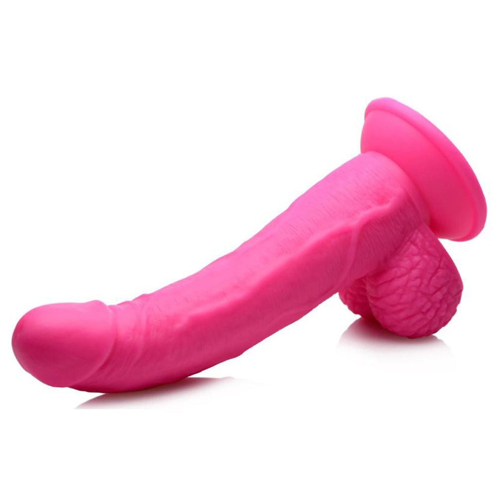 Pink 7.5-inch realistic PVC dildo with veiny shaft, balls, and suction cup base.