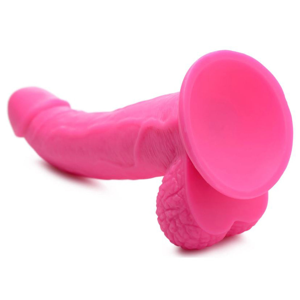 Pink 7.5-inch realistic PVC dildo with veiny shaft, balls, and suction cup base.