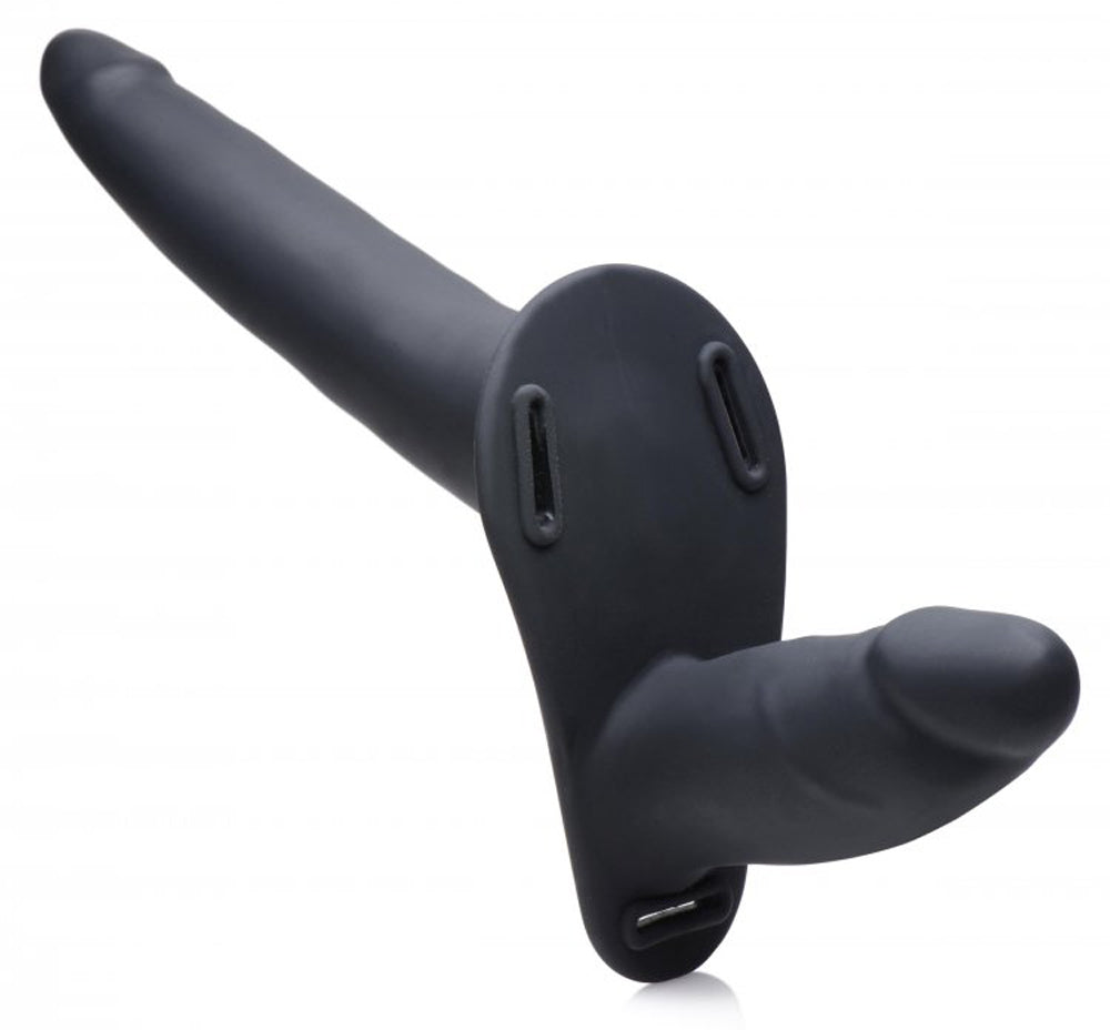 Black vibrating double dildo with a pegging harness.