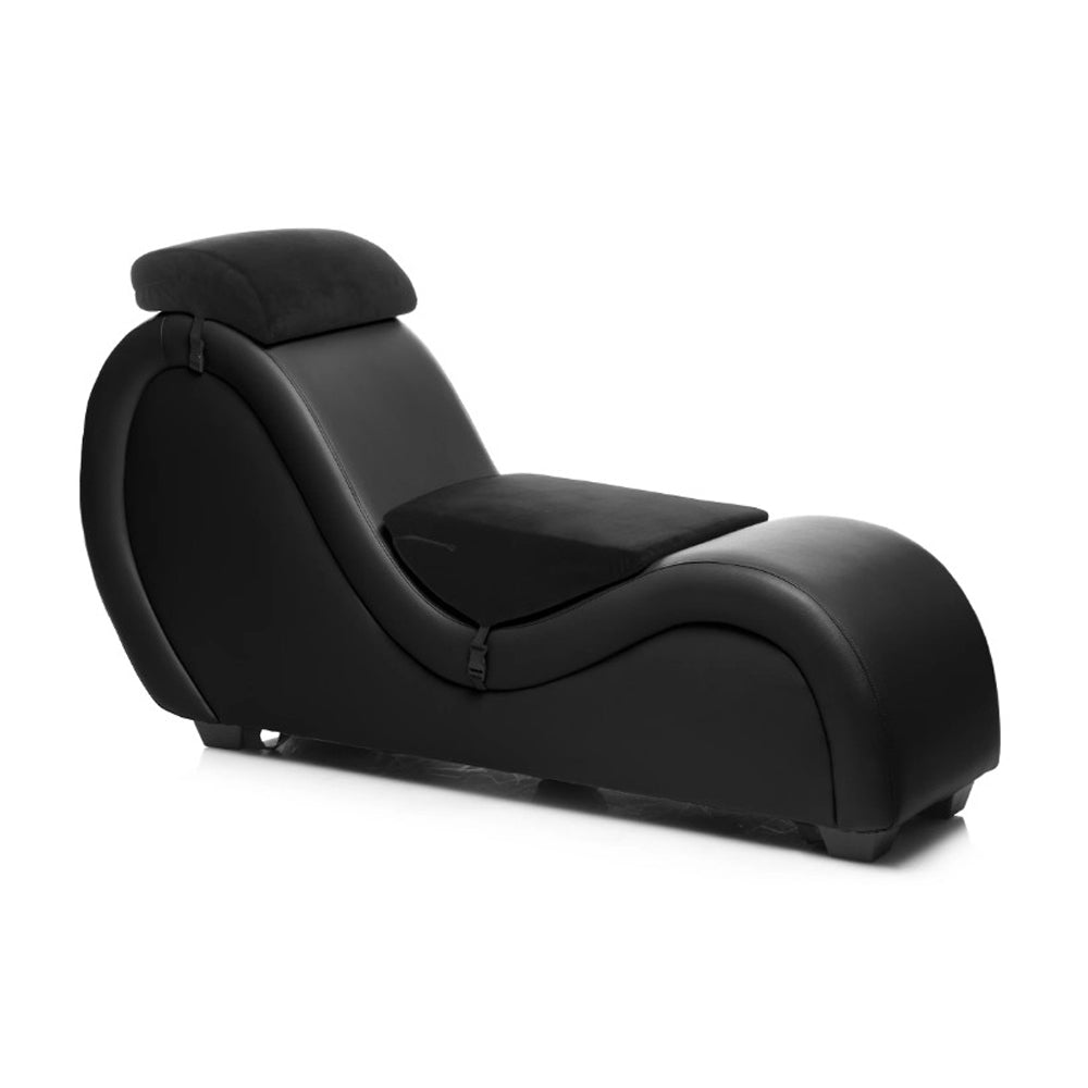 Black PU leather chaise lounge with headrest and positioning cushion.