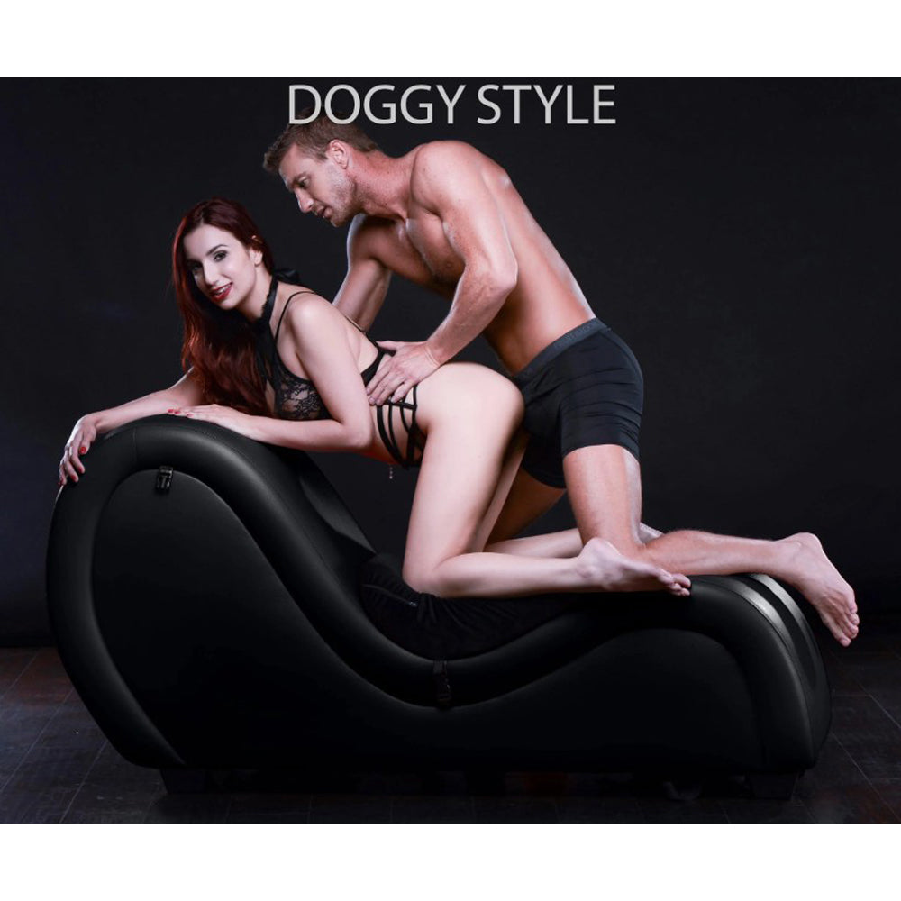 Black PU leather chaise lounge with straps and cuffs.