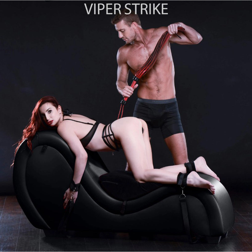 Black PU leather bondage chaise lounge with straps and cuffs.