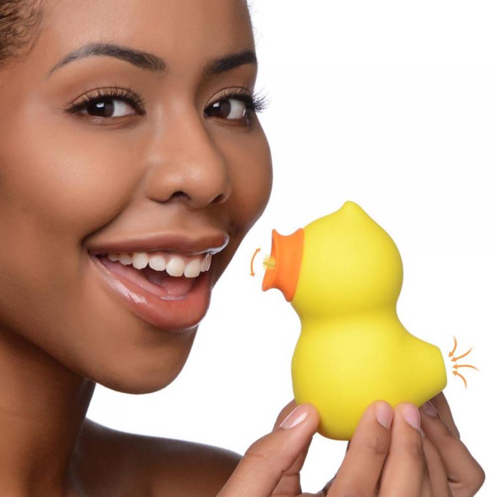 Yellow duck-shaped clitoral suction and licking toy.