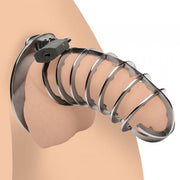 Stainless steel spiked chastity cage with a padlock.