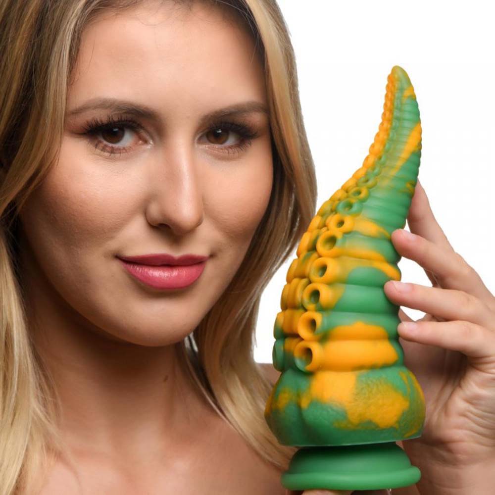 Green and yellow marbled silicone tentacle dildo with suction cup base.